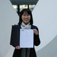 Image of Xian Liao with her Certificate of Appointment
